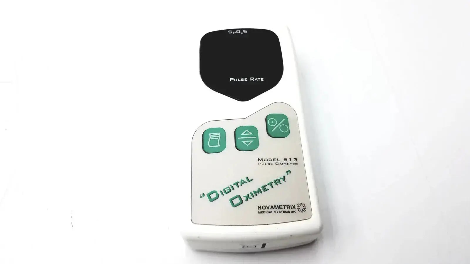 White plastic Novametrix 513 pulse oximeter monitor with black display and green pulse rate buttons for accurate readings