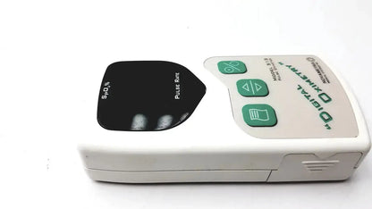 Novametrix 513 pulse oximeter monitor with white body green buttons and black sensor pad for accurate oxygen tracking
