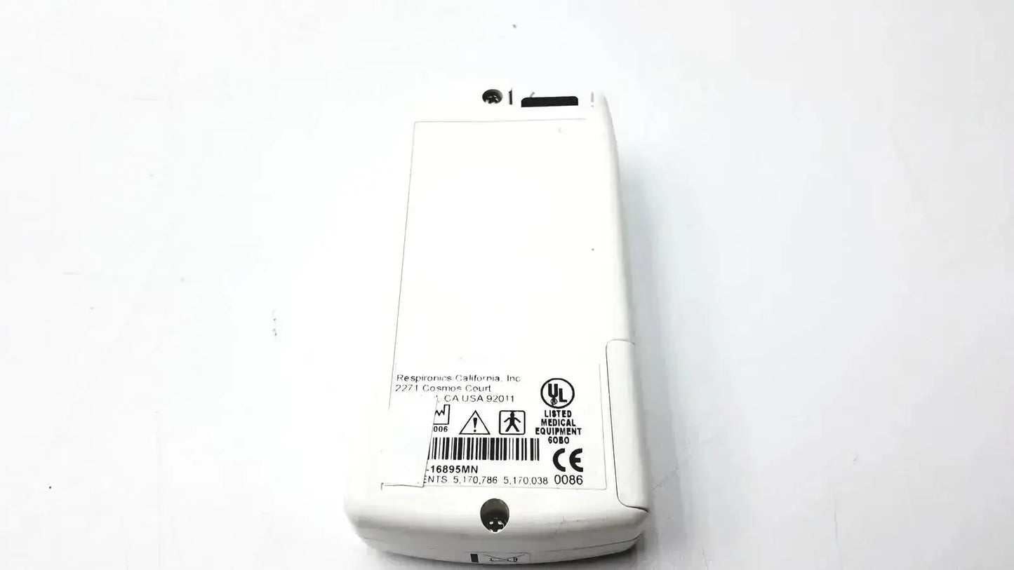 White plastic Novametrix 513 pulse oximeter monitor with printed labels and certification marks on the back side