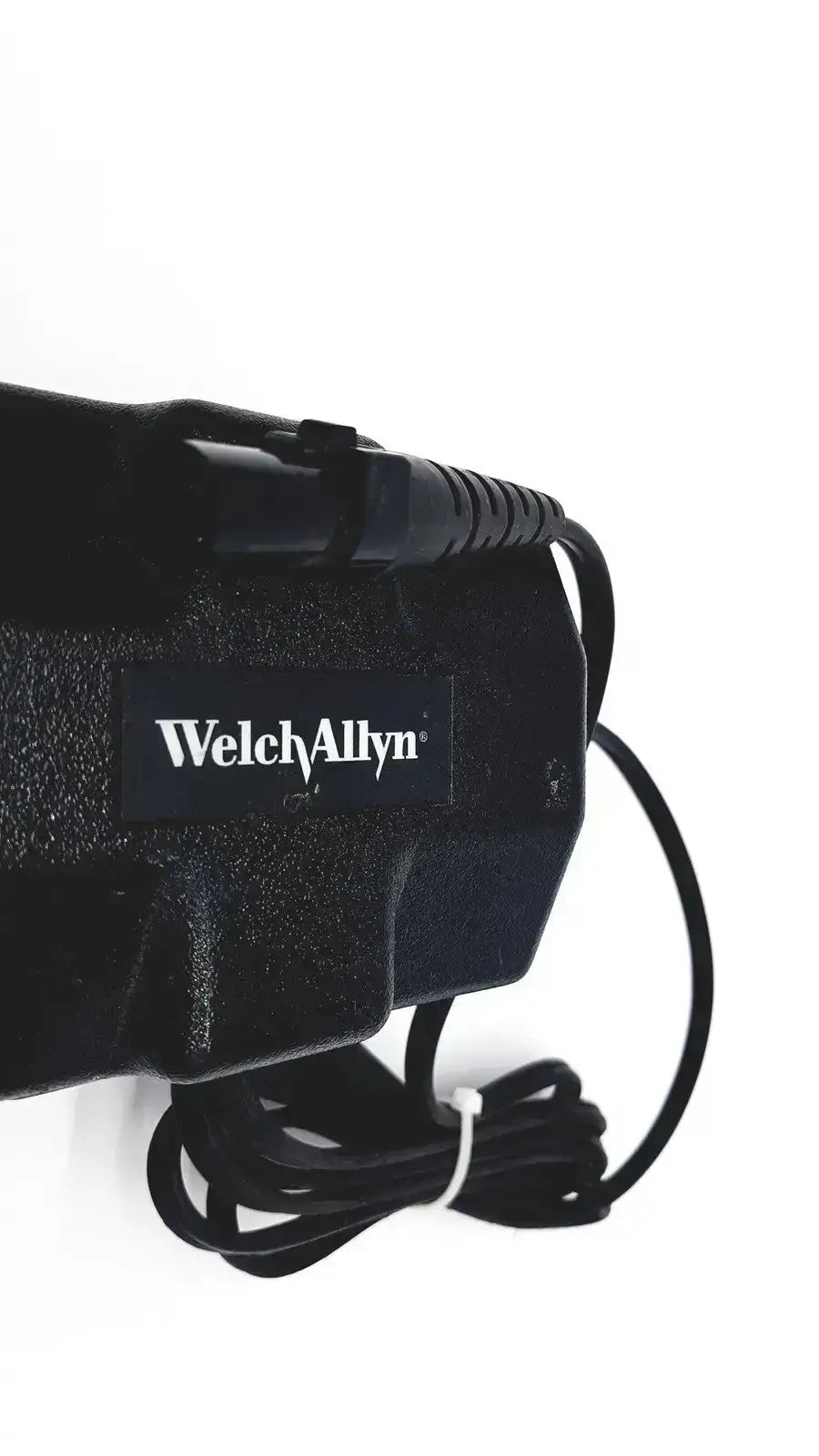 Black welch allyn propaq oem power supply with textured plastic casing and coiled power cord for patient monitor charger