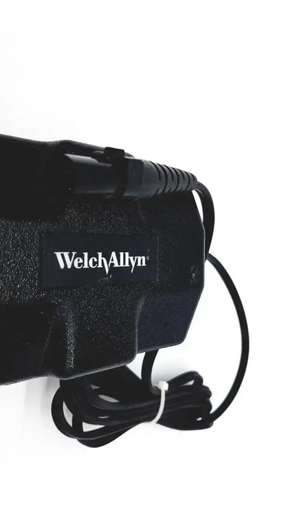 Black welch allyn propaq oem power supply with textured plastic casing and coiled power cord for patient monitor charger
