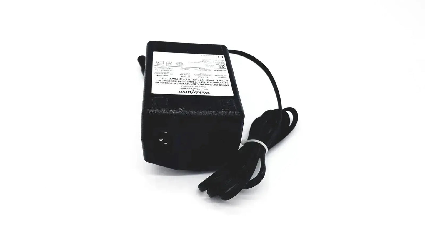 Black rectangular oem power supply with coiled cable and white label for welch allyn propaq patient monitor charger