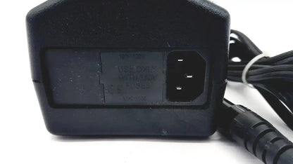 Black plastic oem power supply with coiled cable and plug for welch allyn propaq patient monitor charger