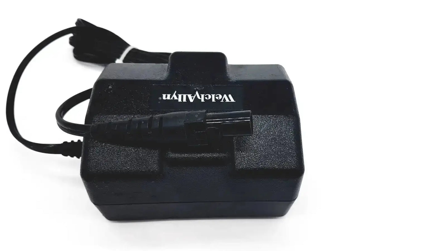 Black plastic oem power supply with coiled cord and velleman logo for welch allyn propaq patient monitor charger
