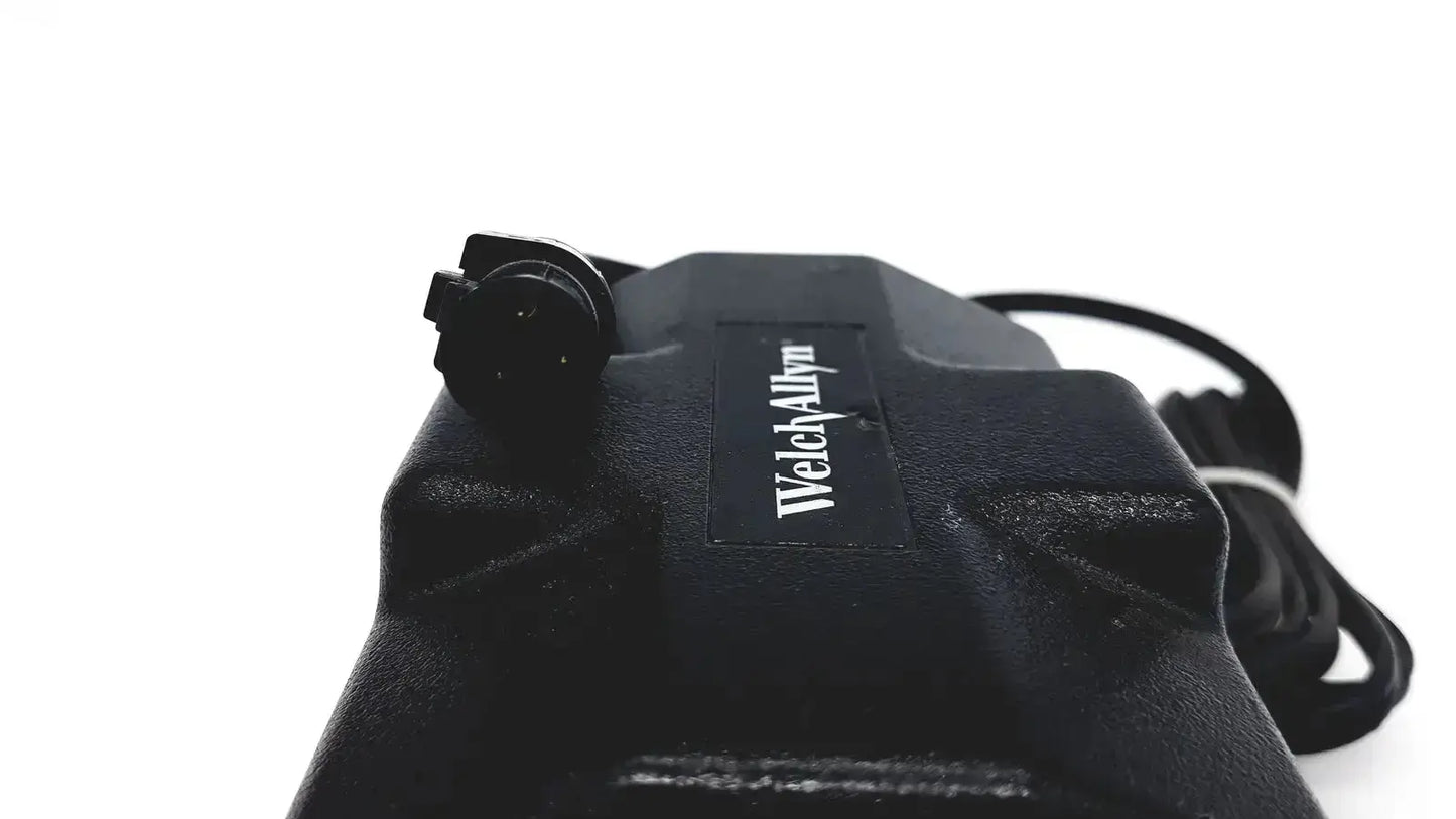 Black oem power supply for welch allyn propaq patient monitor with textured plastic casing and coiled black cable