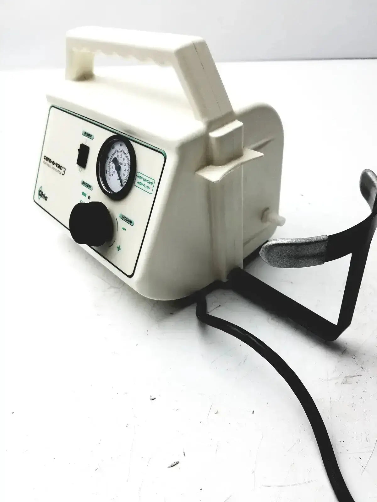 Off-white ohio medical care-e-vac 3 portable aspirator suction pump with pressure gauge control knobs and black metal stand