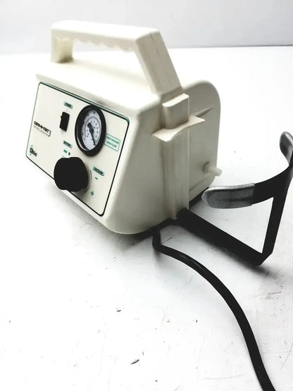 Off-white ohio medical care-e-vac 3 portable aspirator suction pump with pressure gauge control knobs and black metal stand