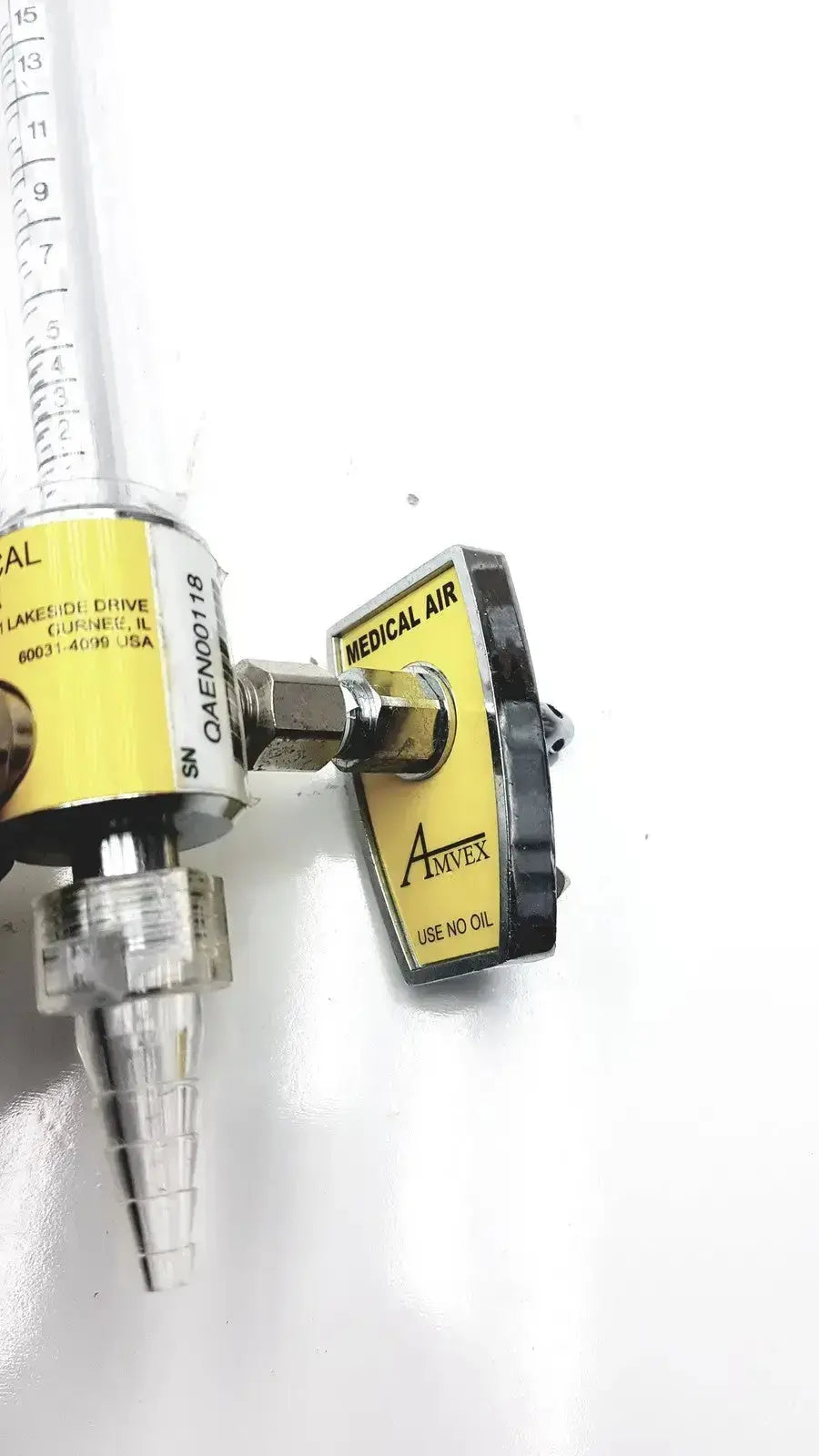 Yellow and black amvex medical air regulator with clear graduated flow meter for ohio medical compressor inlet 50 psig