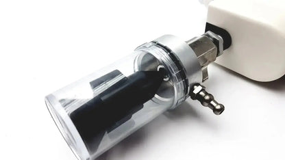 Clear cylindrical Ohio medical vacuum regulator with black internal component and metallic fittings for medical use