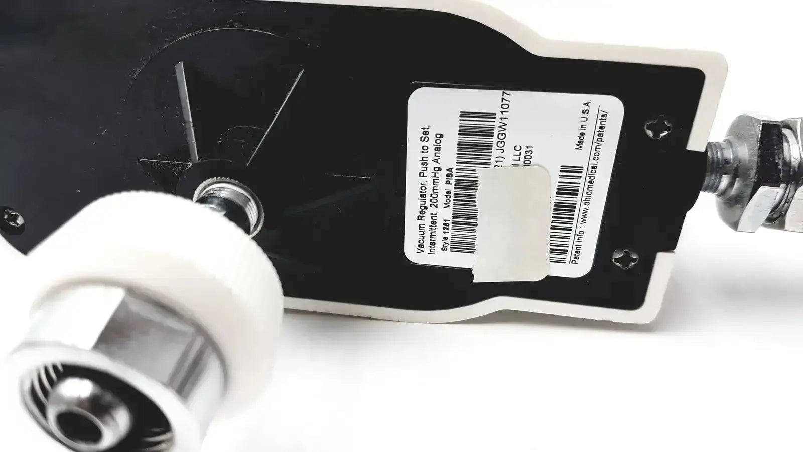 Black ohio medical vacuum regulator push-to-set with white label and silver metallic fittings for medical use