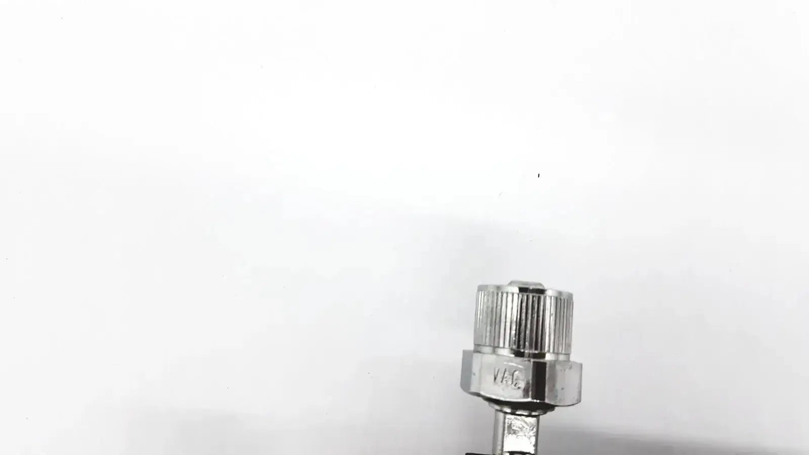 Silver metallic valve with knurled hexagonal head and threaded body for ohmeda ffa19643 intermittent unit