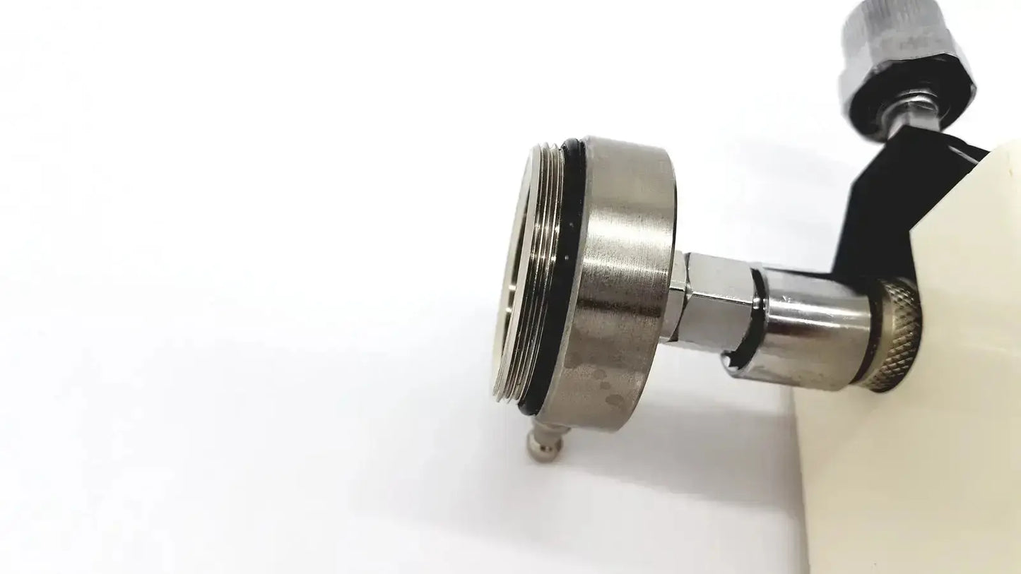 Silver metallic faucet adapter with threaded connections and black rubber seal for ohmeda ffa19643 intermittent unit