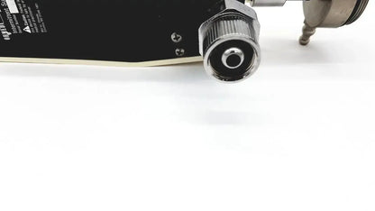 Black skateboard deck with metallic silver threaded connector and screws on ohmeda ffa19643 intermittent unit back side