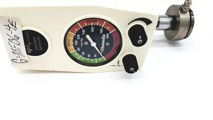 Cream-colored ohmeda ffa19643 intermittent suction unit with circular gauge showing red green and black pressure zones