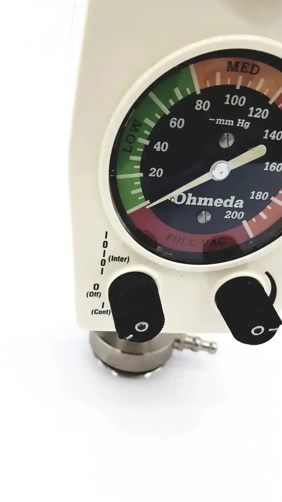 Cream-colored ohmeda ffa19643 intermittent unit medical ventilator with circular mm hg pressure gauge and black control knobs