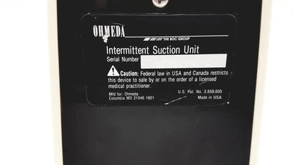 Black ohmeda ffa19643 intermittent unit showing white label with model serial and regulatory information on back side
