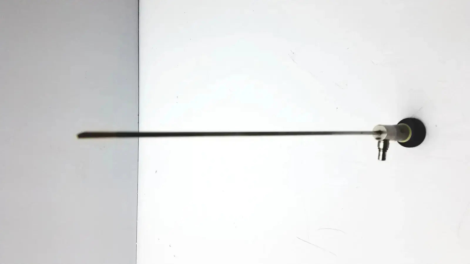 A sleek metallic olympus a22003a rigid endoscope with a 4mm x 70º slender shaft and black circular base