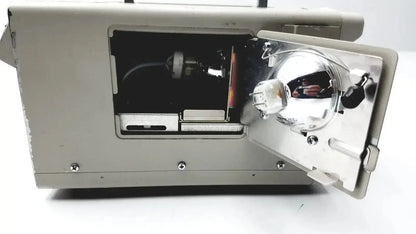Gray metal Olympus CLK-4 halogen light source with reflective silver lens assembly and visible internal components
