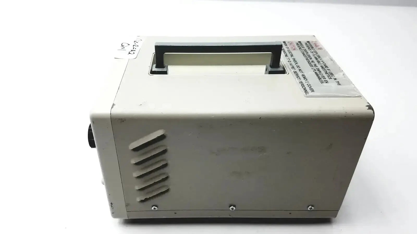 Beige rectangular Olympus CLK-4 halogen light source with black handle and vent slits for efficient halogen light use