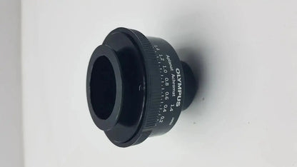 Black Olympus microscope condenser aplanat achromat 1.4 with engraved markings and textured focus ring adapter