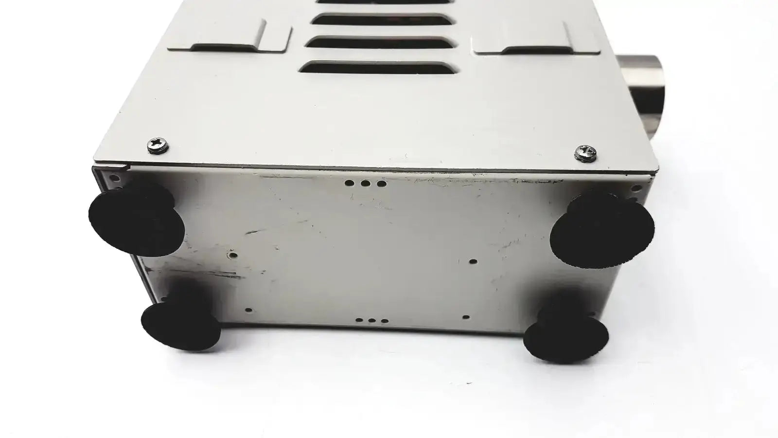 Silver metallic olympus mu-1 endoscope maintenance unit with black rubber feet and ventilation slits for endoscope maintenance