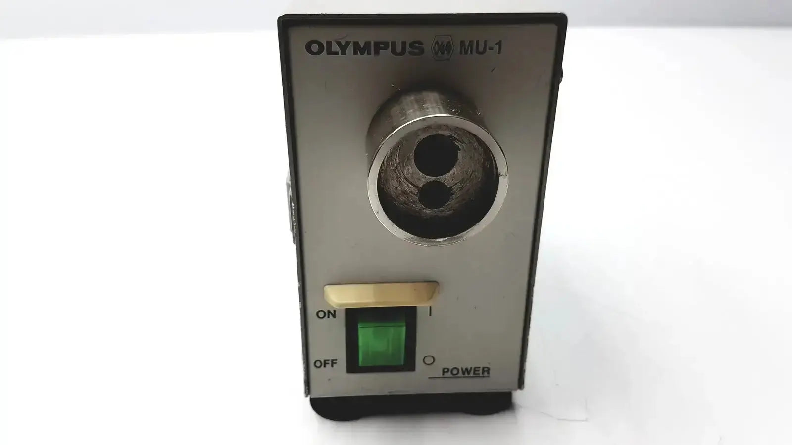 Olympus mu-1 endoscope maintenance unit with metallic cylindrical pencil sharpener hole and green power indicator light