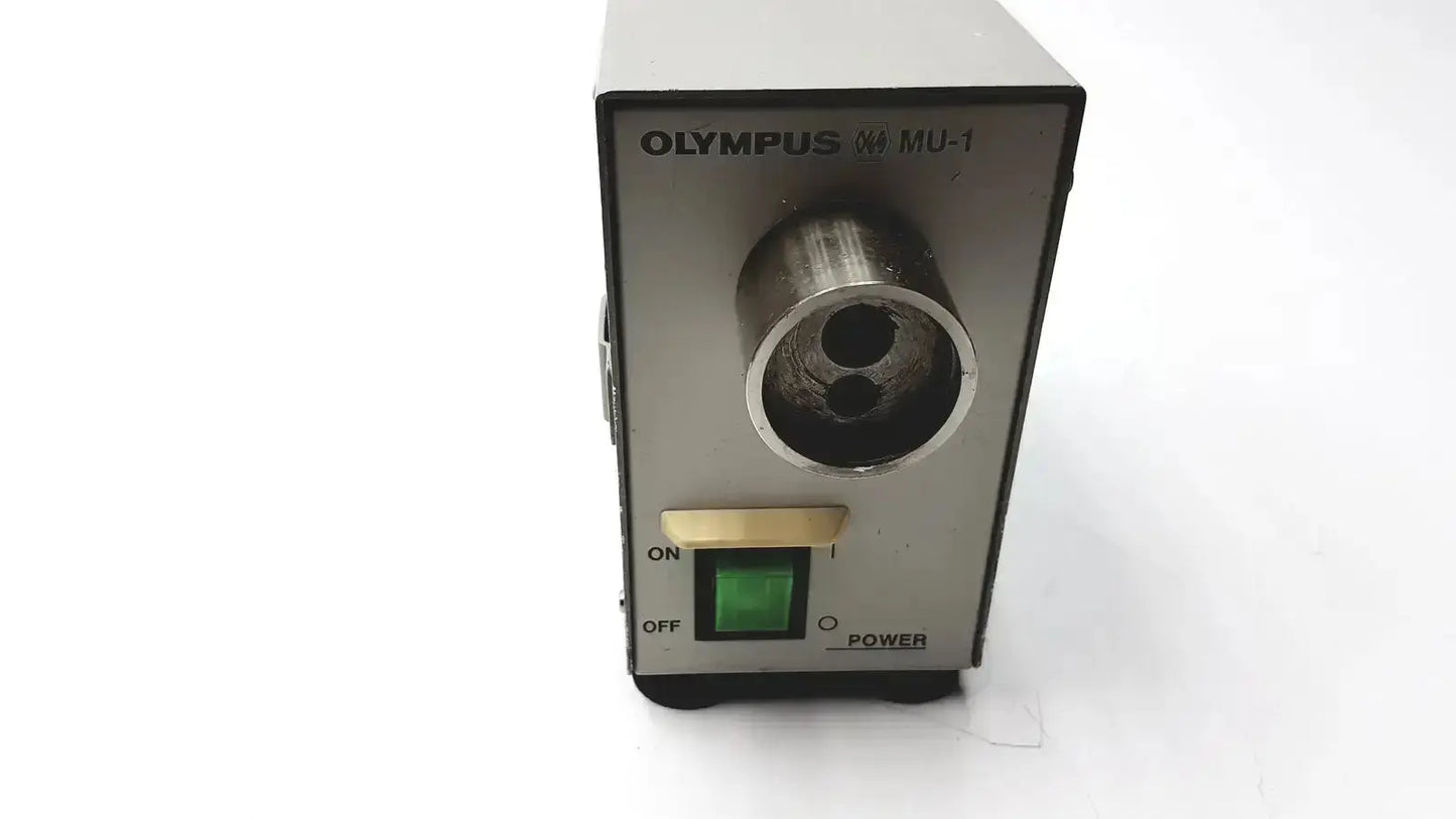 Silver olympus mu-1 endoscope maintenance unit with metallic cylindrical tip and green power indicator for endoscope maintenance