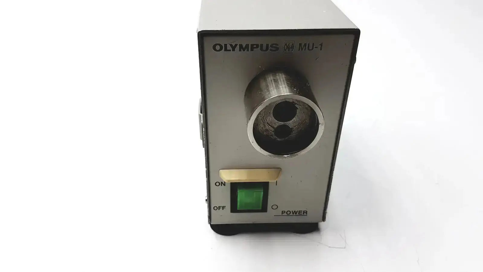 Silver olympus mu-1 endoscope maintenance unit with metallic cylindrical tip and green power indicator for endoscope maintenance