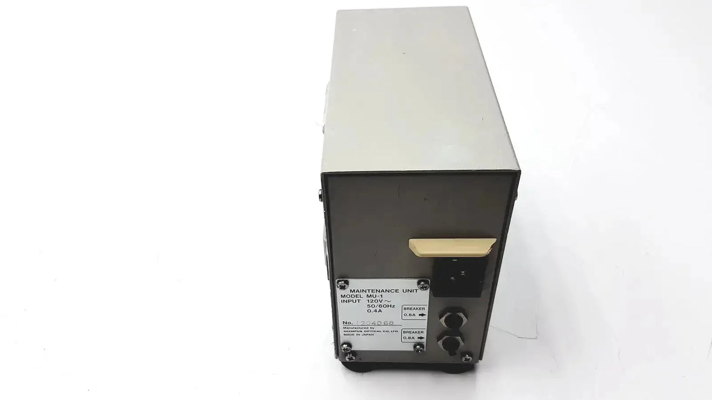 Silver metallic olympus mu-1 endoscope maintenance unit with black front panel and beige power switch for endoscope maintenance