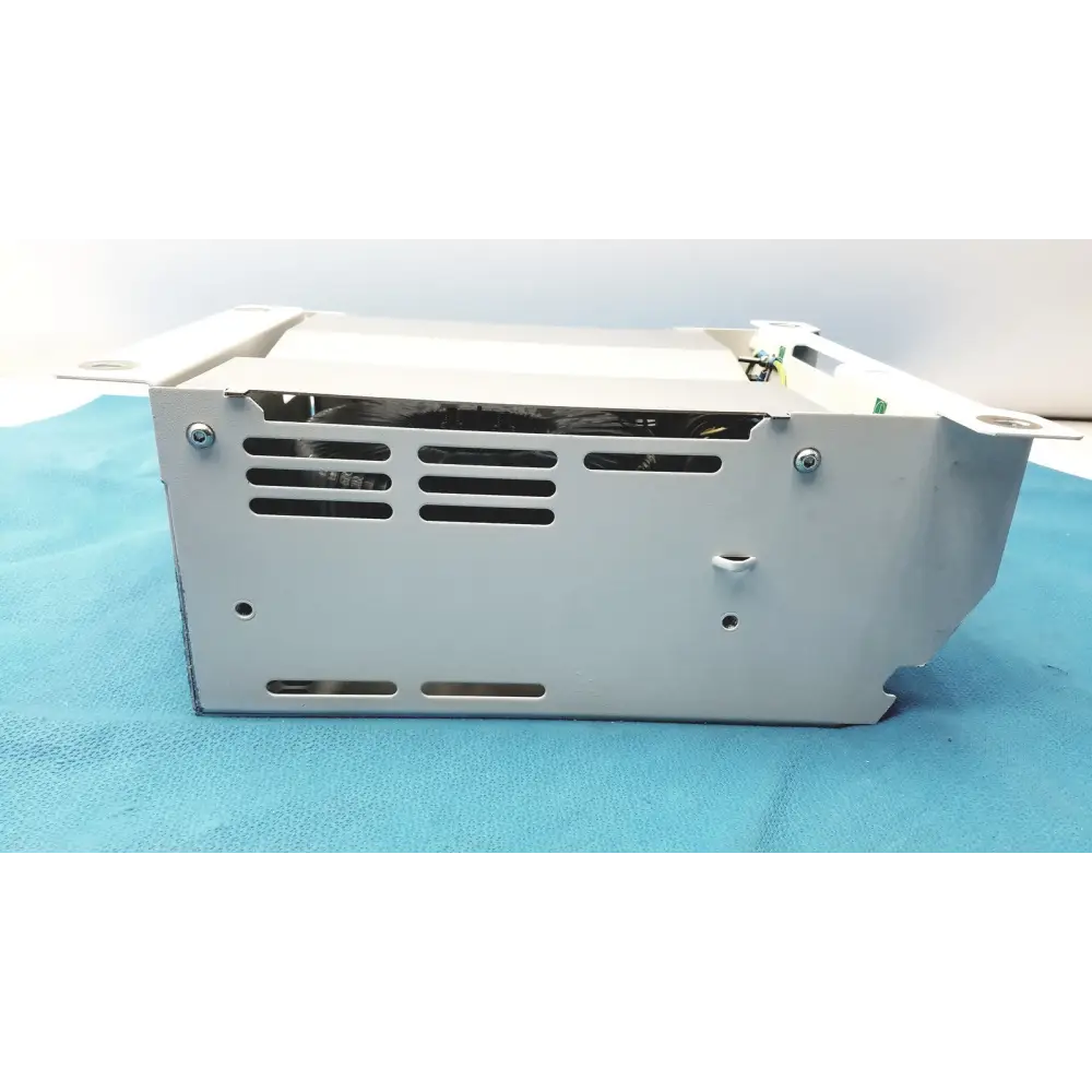 Silver metallic power supply unit with a rectangular design and ventilation slots along its sides.