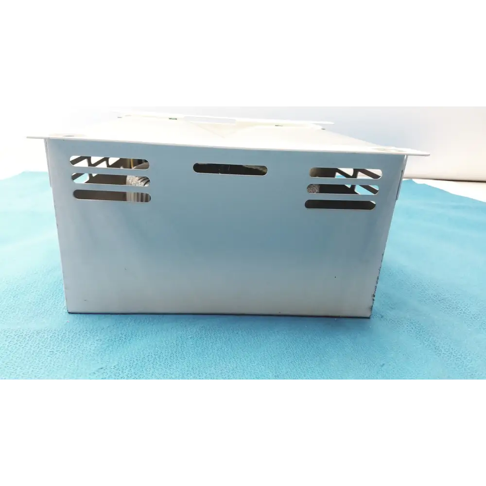 Silver metallic rectangular power supply unit with ventilation slots on the sides.