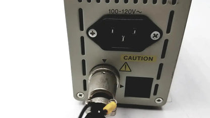 Silver metallic olympus th4-100 100w 120v halogen power supply with black ac input plug and threaded output connector