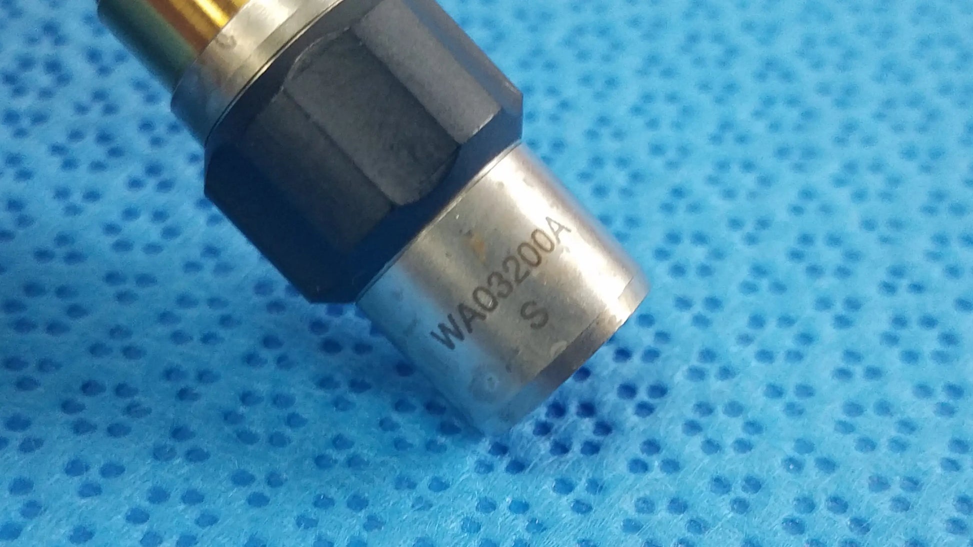 Silver metallic sensor with black hexagonal housing and engraved model number wa03200a for reuse medical equipment olympus wa03200a