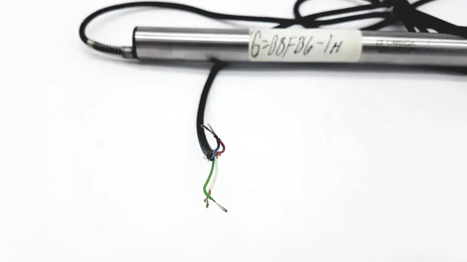 Silver cylindrical omega ld300-150 lvdt linear position sensor with black cable and exposed multi-colored wires