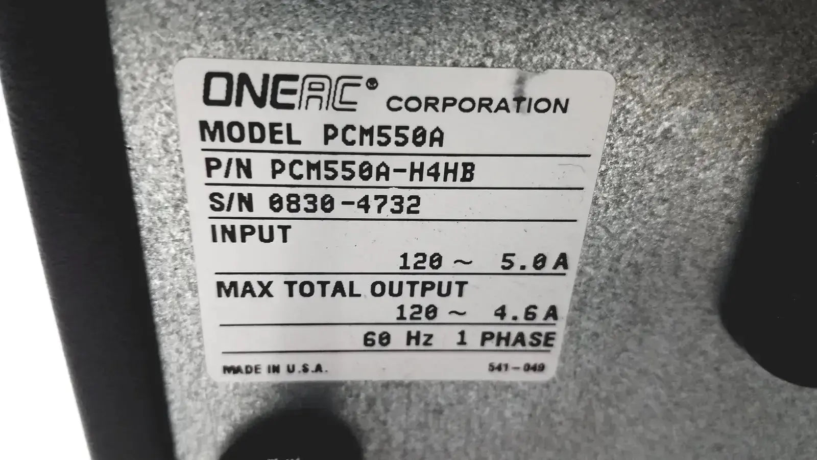 Onerac conditioned power pcm550a power supply unit with white label showing model part number and electrical specs