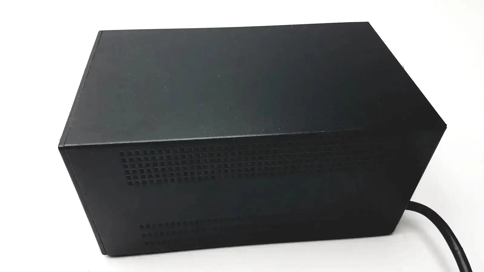 Black rectangular power supply unit with perforated vent and cable for oneac conditioned power pcm550a back side