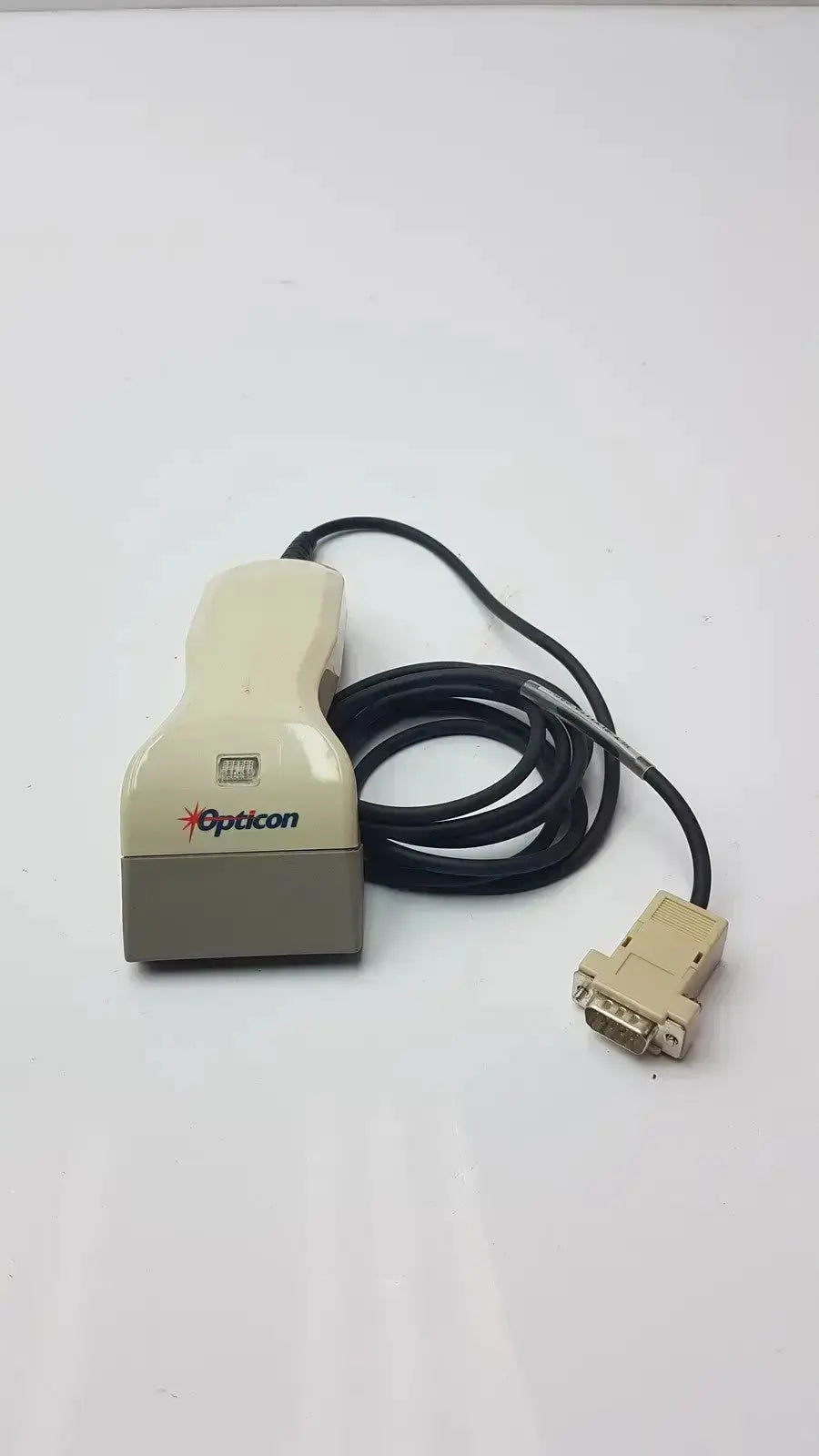 Beige opticon barcode scanner opt-1125 with coiled black cable and db-9 connector for pre owned medical equipment use