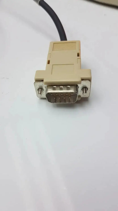 Beige plastic db-25 serial connector with metallic pins and black cable for opticon barcode scanner opt-1125 pre owned medical equipment