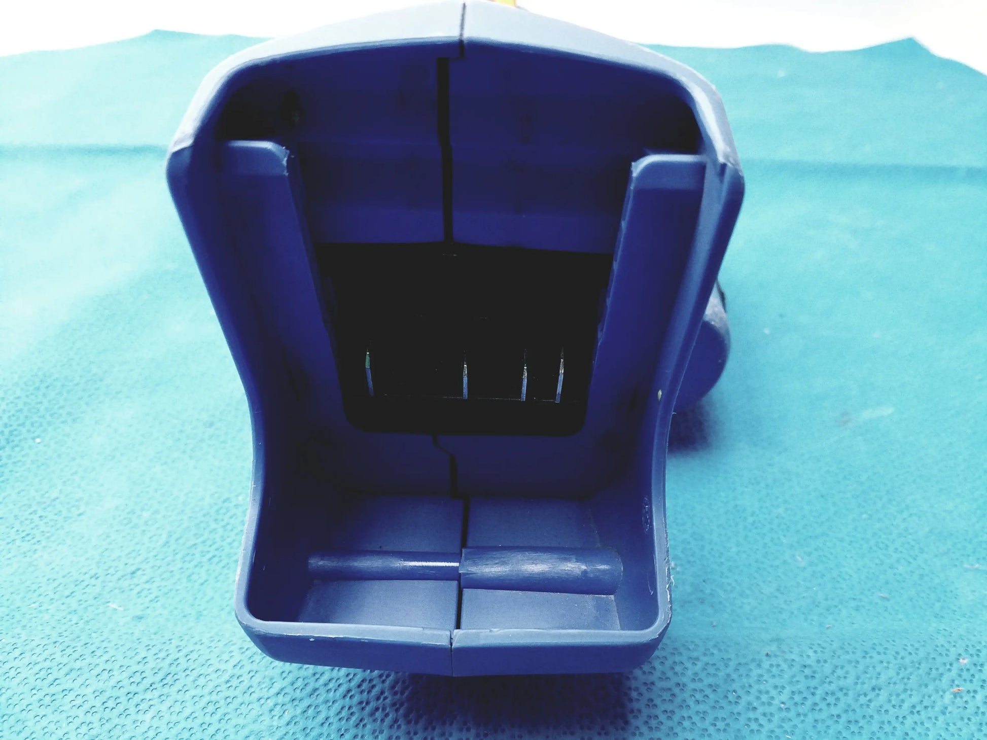 Blue plastic tool case with divided interior and four metal pins for orgapack or-t 250 battery operated cordless strapping tool