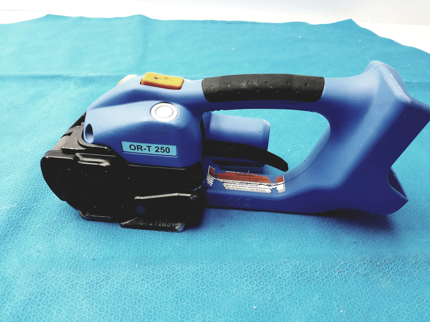 Orgapack OR-T 250 blue and black battery operated cordless electric banding tool with textured grip handle for medical equipment reuse