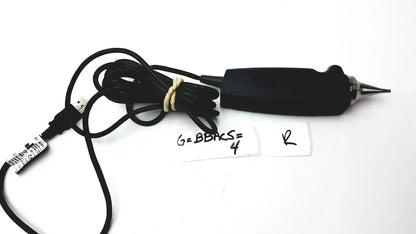 Black handheld electric engraving tool with pointed metal tip and coiled usb cable for hearing care video otoscope use