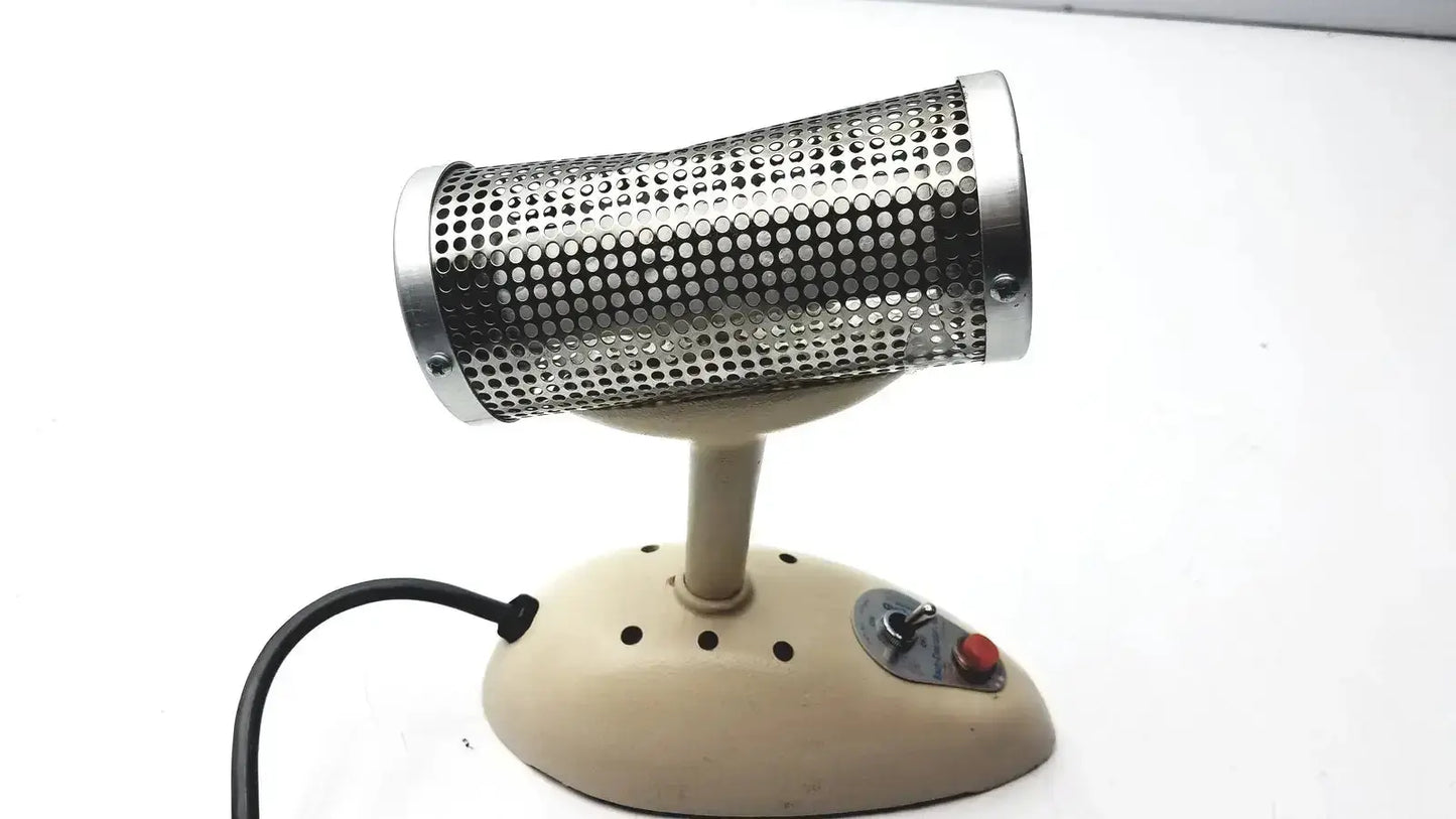Vintage-style electric hair dryer with perforated metal barrel and beige plastic base in oxford labware bacti-cinerator iii sterilizer