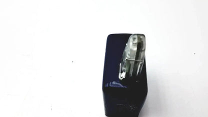 A sleek black oxsim ox-1 pulse oximeter simulator with a transparent metallic-tipped stapler mechanism