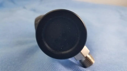 Black rubber cap with metallic threaded connector for oxygen regulator medical gas flow control device in medical equipment