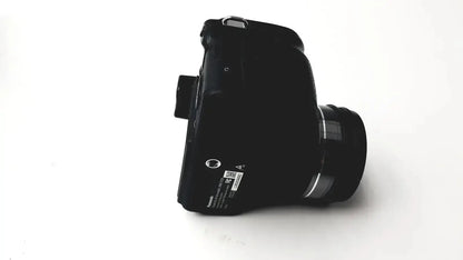 Black panasonic model dmc-fz35 digital camera with sleek matte finish silver lens accents and lumix de-a43 battery charger