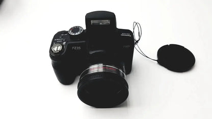 Black Panasonic Model DMC-FZ35 digital camera with lens cap beside it and Lumix DE-A43 battery charger