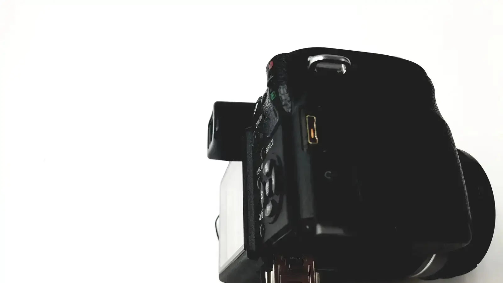 Black matte finish digital camera with control dials shown in panasonic model dmc-fz35 with lumix battery charger