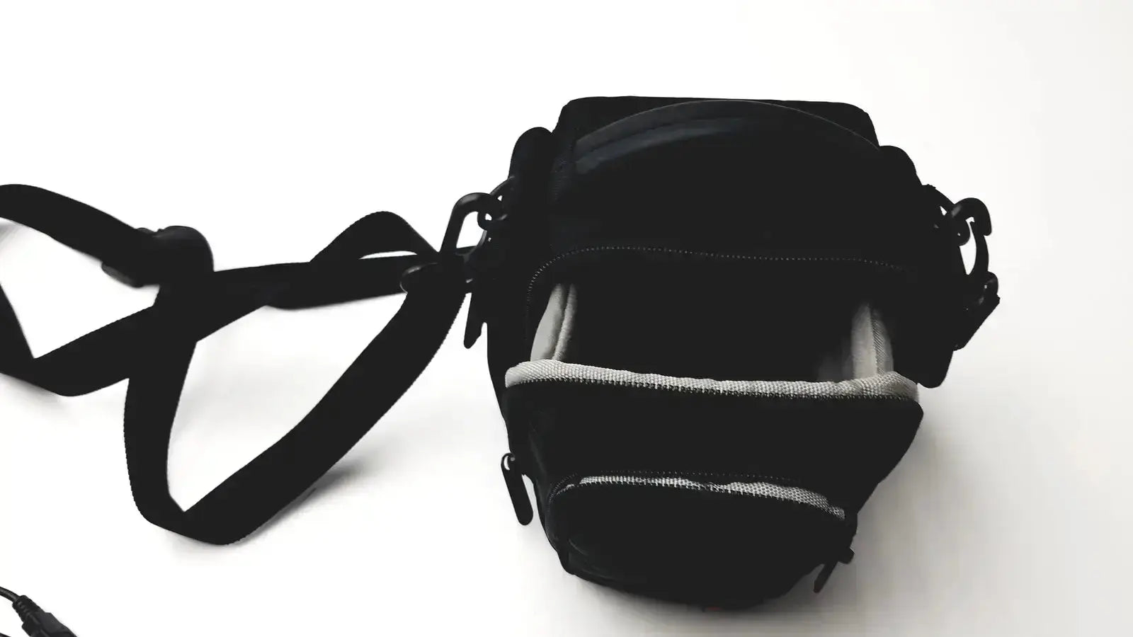 Black camera bag with adjustable strap and interior lining for Panasonic model dmc-fz35 digital camera with charger
