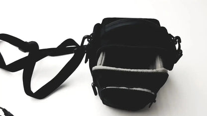 Black camera bag with adjustable strap and interior lining for Panasonic model dmc-fz35 digital camera with charger