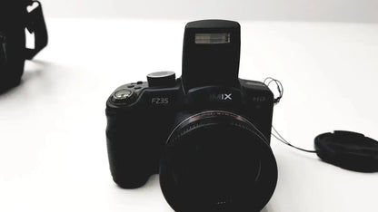 Black fujifilm finepix fz35 digital camera with built-in flash and lens cap near panasonic model dmc-fz35 battery charger